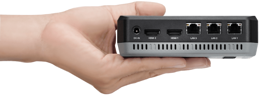 A hand holding TANGO 3010 palm sized industrial mini PC
